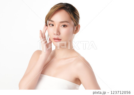 A beautiful young Asian woman with clean, fresh skin against a white background. She represents beauty, skincare, and spa treatments. A beautiful young Asian woman with clean, fresh skin against a white background. She represents beauty, skincare, and spa treatments. 123712056