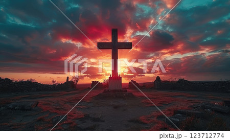 Silhouette of a wooden cross against a dramatic sunset sky. Symbol of faith, hope, and spirituality 123712774