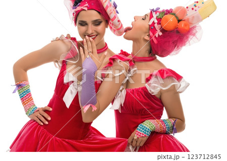 Creative dancing duo in colorful costumes celebrates festive atmosphere 123712845