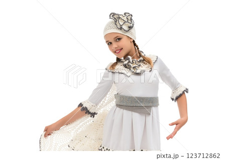 Young girl performing traditional dance in elegant costume during celebration Young girl performing traditional dance in elegant costume during celebration 123712862