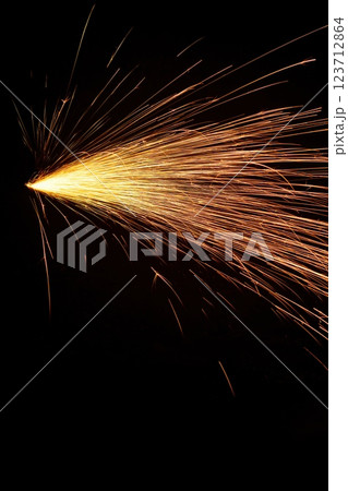 Sparkling display of fireworks lighting up the night sky in celebration Sparkling display of fireworks lighting up the night sky in celebration 123712864