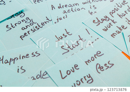 Inspirational quotes on paper cards promoting positivity and motivation 123713876