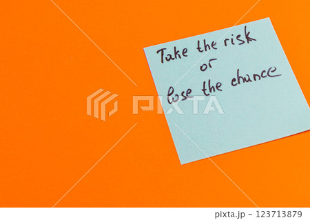 Bright motivational note encourages taking risks for a fulfilled life 123713879