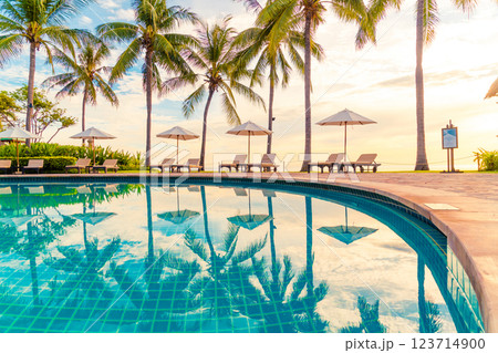 Umbrella and chair around swimming pool in resort hotel for leisure travel and vacation neary sea ocean beach Umbrella and chair around swimming pool in resort hotel for leisure travel and vacation neary sea ocean beach 123714900