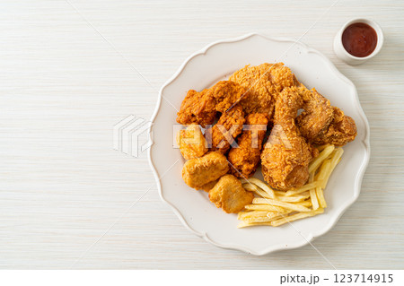 fried chicken with french fries and nuggets on plate 123714915