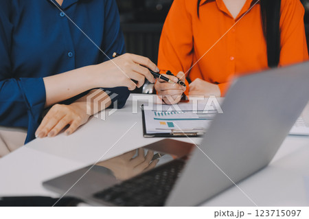 Entrepreneur Asian businessman and businesswoman discussing new business project in tablet in modern Meeting In Modern Office, Asian business casual concept. Entrepreneur Asian businessman and businesswoman discussing new business project in tablet in modern Meeting In Modern Office, Asian business casual concept. 123715097