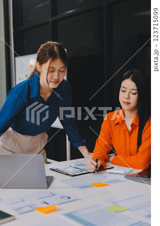 Entrepreneur Asian businessman and businesswoman discussing new business project in tablet in modern Meeting In Modern Office, Asian business casual concept. Entrepreneur Asian businessman and businesswoman discussing new business project in tablet in modern Meeting In Modern Office, Asian business casual concept. 123715099