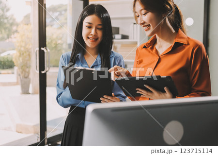 Entrepreneurs and business people conference in modern meeting room, happy multiracial coworkers have fun cooperating working together at office meeting, asian teamwork concept 123715114