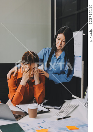 Asian women are stressed or has sore throat at office while working on laptop, Tired asian businesswoman with headache at office, feeling sick at work, copy space Asian women are stressed or has sore throat at office while working on laptop, Tired asian businesswoman with headache at office, feeling sick at work, copy space 123715119