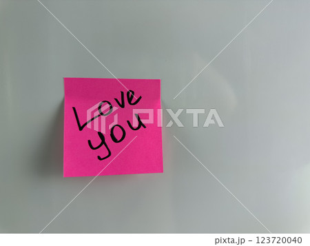 Sweet message with words of love written on sticky note Sweet message with words of love written on sticky note 123720040