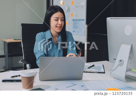 Entrepreneur Asian businessman and businesswoman discussing new business project in tablet in modern Meeting In Modern Office, Asian business casual concept. Entrepreneur Asian businessman and businesswoman discussing new business project in tablet in modern Meeting In Modern Office, Asian business casual concept. 123720135