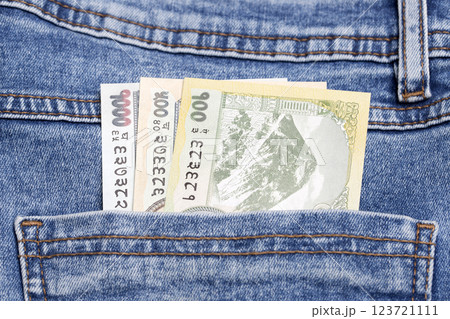 Nepalese Rupee in the pocket of blue jeans 123721111