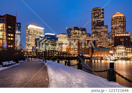 View of Boston downtown  skyscrapers seen from Fan Pier Park on a cold cloudy winter night View of Boston downtown  skyscrapers seen from Fan Pier Park on a cold cloudy winter night 123721646