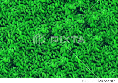 顕微鏡を覗いて蛍光緑色の微細胞や細菌がひしめき合うようなイメージ黒背景テクスチャー 123722707