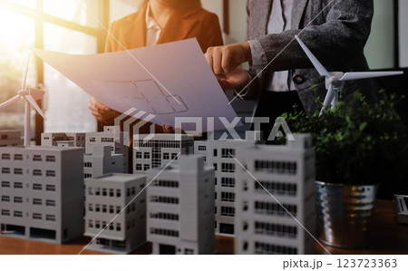 Discussion among businesspeople on the latest developments in solar cell panel technology and Solar Energy Environment city Concept. 123723363