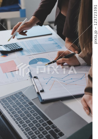 Accounting company provide finance and taxation planning for profitable cash flow, Auditor and accountant team working in office, analyze financial data and accounting record with calculator.Insight Accounting company provide finance and taxation planning for profitable cash flow, Auditor and accountant team working in office, analyze financial data and accounting record with calculator.Insight 123723391