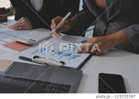 Accounting company provide finance and taxation planning for profitable cash flow, Auditor and accountant team working in office, analyze financial data and accounting record with calculator.Insight 123723397