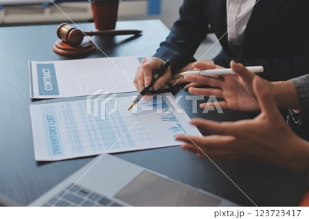 Judge gavel with Justice lawyers having team meeting at law firm background. Concepts of Law and Legal services. 123723417