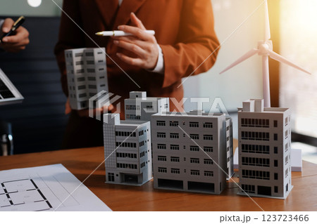 Discussion among businesspeople on the latest developments in solar cell panel technology and Solar Energy Environment city Concept. 123723466