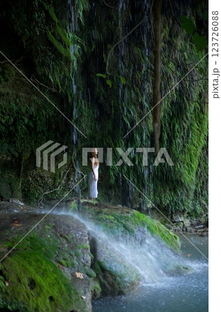 Woman Standing Under Antalya Duden Famous Waterfall in Green Paradise Woman Standing Under Antalya Duden Famous Waterfall in Green Paradise 123726088