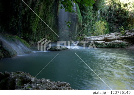 Antalya Famous Waterfall Flowing Into a Serene River  123726149