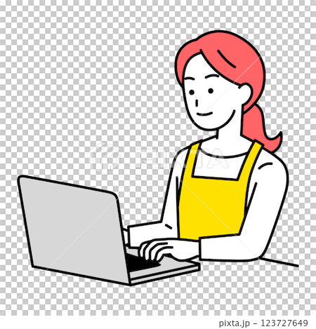 A woman in an apron operating a laptop 123727649