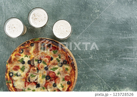 Delicious italian pizza with beer Delicious italian pizza with beer 123728526