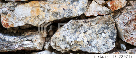Wall stone foreground. Stacked natural stone background Wall stone foreground. Stacked natural stone background 123729715