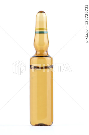 Clear brown glass ampoule filled with liquid medicine. High quality photo Clear brown glass ampoule filled with liquid medicine. High quality photo 123729733