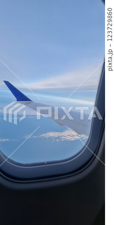 View to the wing of the plane 123729860