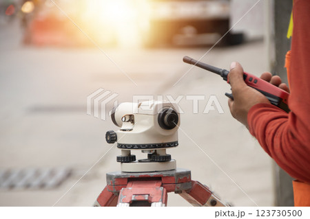 Engineers are using cameras to measure levels. Engineers are using cameras to measure levels. 123730500