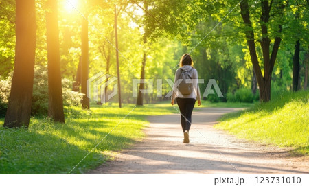 Mindful walk in a green park, enjoying nature therapy and finding balance with a slow, present moment approach. 123731010