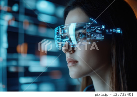 A woman wearing a pair of virtual reality goggles 123732401