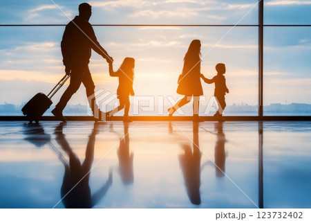 Family Excitement While Boarding an Airplane at the Airport During Sunset Moments Family Excitement While Boarding an Airplane at the Airport During Sunset Moments 123732402