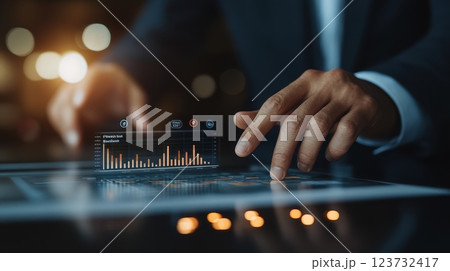 Businessman Analyzing Sales Data with Technology Businessman Analyzing Sales Data with Technology 123732417