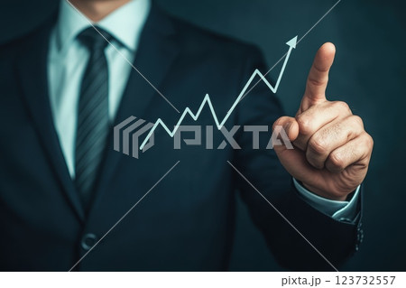Businessman Pointing at Investment Growth Graph with Professional Background Businessman Pointing at Investment Growth Graph with Professional Background 123732557