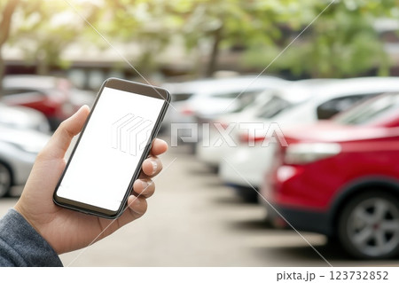 Hand Holding Smartphone with Blank Screen in Outdoor Parking Lot Hand Holding Smartphone with Blank Screen in Outdoor Parking Lot 123732852