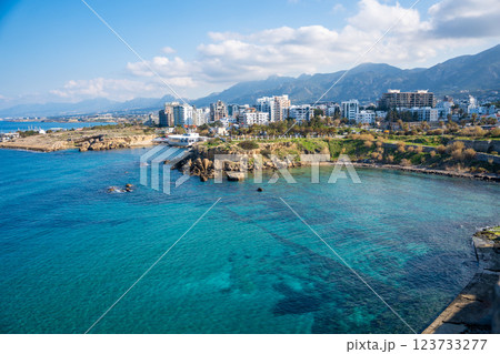 A panoramic view of the city from the fortress in Girne, Northern Cyprus. The historic walls overlook the urban landscape, blending medieval architecture with modern life 123733277