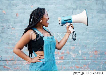 Megaphone, protest and black woman with speech, rally and announcement for politics, equality and human rights. Feminist, revolution and loud communication with voice shouting for justice and freedom 123733931