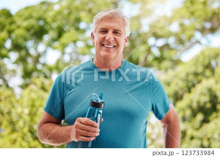 Fitness, garden and a senior man with water bottle, exercise and hydrate in retirement. Health, nature and workout, a happy elderly guy from Canada with smile standing in outdoor park on a summer day 123733984