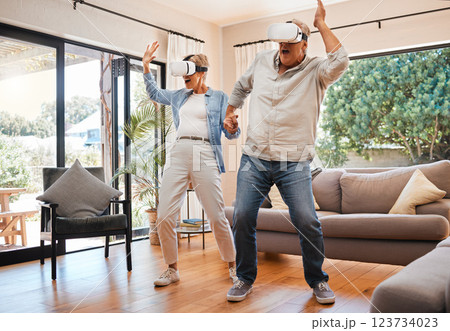Vr dance, 3d and senior couple with games for creative, futuristic and comic happiness in the living room of the house. Elderly man and woman playing metaverse and digital dancing on technology 123734023