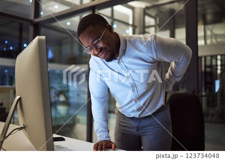 Stress at night, tired employee with back pain working at night and risk of burnout or quitting. Career dedication, marketing professional with deadline and motivation to complete project for success 123734048