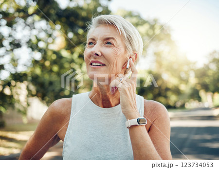 Senior woman, fitness and music earphones for workout, training or exercise in nature park or Sweden garden. Thinking mature person listening to podcast, healthcare radio or wellness motivation audio Senior woman, fitness and music earphones for workout, training or exercise in nature park or Sweden garden. Thinking mature person listening to podcast, healthcare radio or wellness motivation audio 123734053