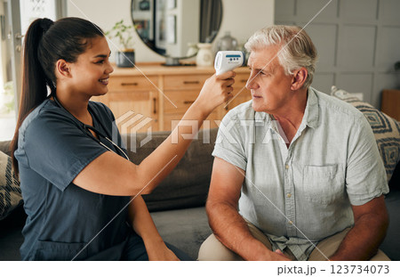 Covid, fever and thermometer with a nurse and patient in his home for a test, checkup or appointment. Medical, healthcare and consulting with a medicine worker and senior man in his house 123734073