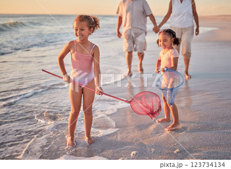 Beach, fishing and children with parents in water for summer vacation, holiday or outdoor growth development and wellness. Happy, excited girl kids and fisherman people or family play with net in sea Beach, fishing and children with parents in water for summer vacation, holiday or outdoor growth development and wellness. Happy, excited girl kids and fisherman people or family play with net in sea 123734134