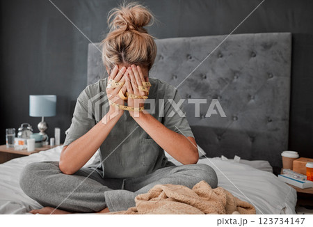 Hands, anorexia and depression with a woman on her bed holding a tape measure and looking sad or frustrated. Mental health, bulimia and eating disorder with a young female in her bedroom at home Hands, anorexia and depression with a woman on her bed holding a tape measure and looking sad or frustrated. Mental health, bulimia and eating disorder with a young female in her bedroom at home 123734147