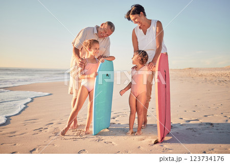 Family, beach and surf with children and parents on the sand by the ocean or sea for surfing, fun and holiday. Water, love and summer with a man, woman and kids on summer vacation at the coast Family, beach and surf with children and parents on the sand by the ocean or sea for surfing, fun and holiday. Water, love and summer with a man, woman and kids on summer vacation at the coast 123734176