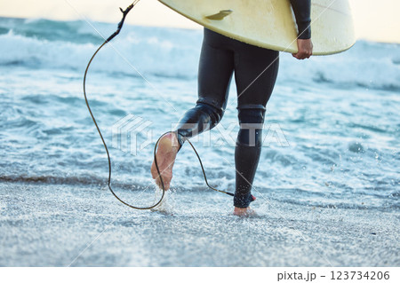Legs, surfboard man at beach and ocean waves for fitness, adventure and healthy lifestyle on Bali summer tropical vacation. Surfer running in sea water, relief of stress and surfing in wet suit. 123734206