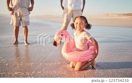Beach, flamingo and child portrait on family holiday in Mexico enjoying summer break. Young, happy and excited girl relaxing on ocean holiday sand for leisure fun with cheerful smile. 123734210