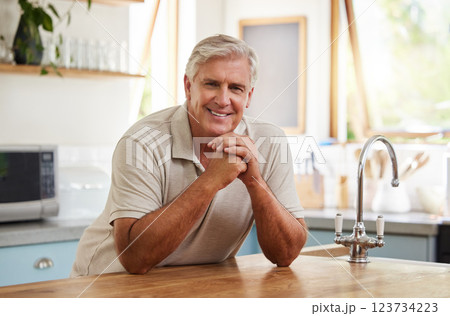 Smile, portrait and senior man in kitchen home alone in retirement. Relax, retired and elderly happy male from Canada in house, thinking and happiness with lifestyle, confidence and positive mindset. Smile, portrait and senior man in kitchen home alone in retirement. Relax, retired and elderly happy male from Canada in house, thinking and happiness with lifestyle, confidence and positive mindset. 123734223